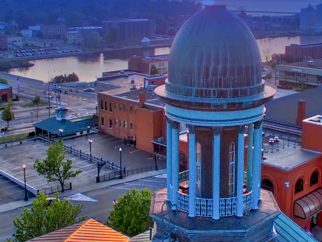 Image of city hall with the Oswego River in the background