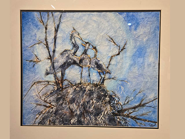 Watercolor named "Dinnertime" by Rose Besch, showing a mother heron feeding two babies in her nest