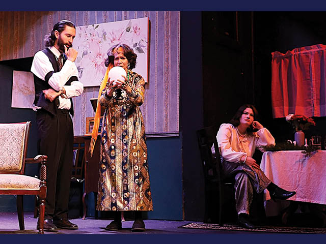 Actors and actresses on stage during Blithe Spirit