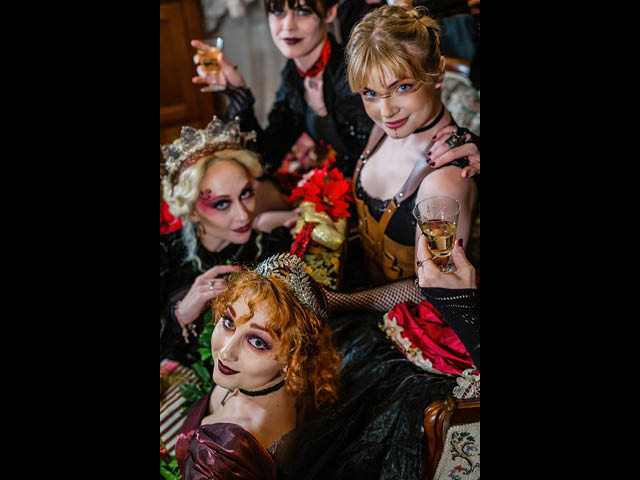 Four women dressed up as Poe characters