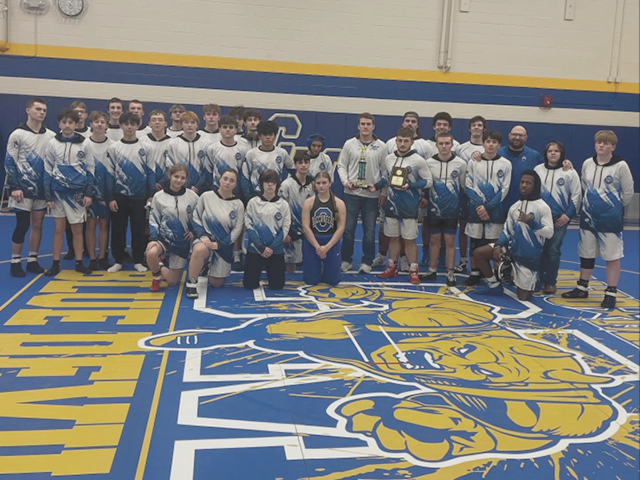 Photo of the full Bucs wrestling team in the gym at Cato-Meridian