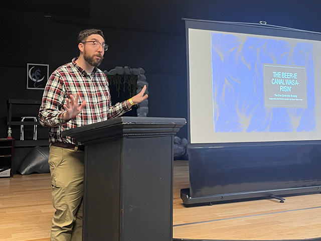 Pratt gesturing at a recent presentation in Fulton