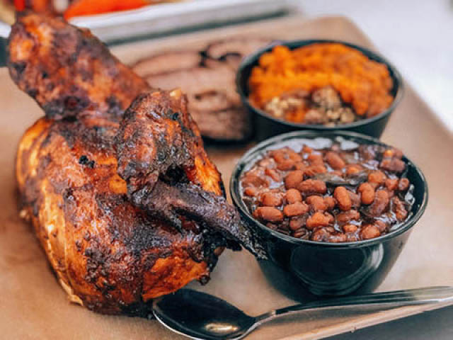 BBQ chicken and baked beans on a tray