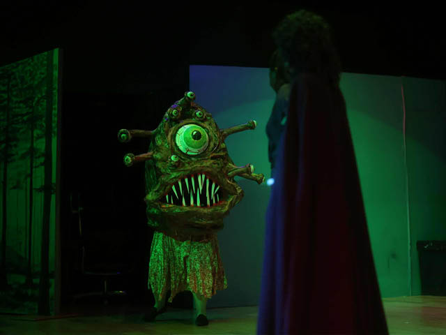 Monster costumed performer on-stage at CNY Arts Center