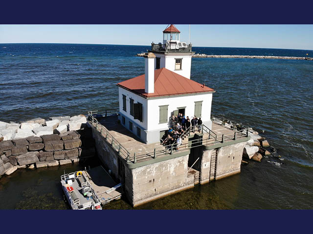 An aerial photo of the Oswego lighthouse on a sunny day