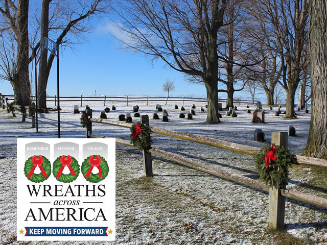 A photo of wreaths on the crosses at Fort Ontario's cemetery during the winter
