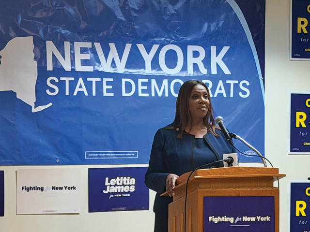 AG James speaking at a podium
