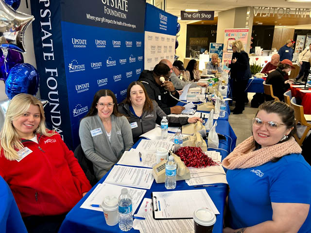 Photo of AmeriCU team members volunteering at the Upstate Foundation Radiothon.