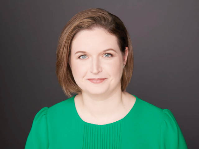 Smiling woman in a green shirt