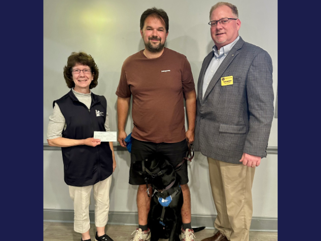 A group photo with a guide dog