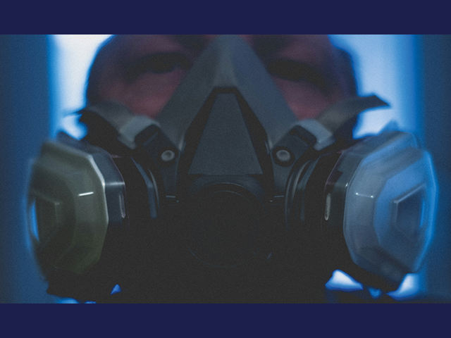 Photo of a person wearing a gas mask