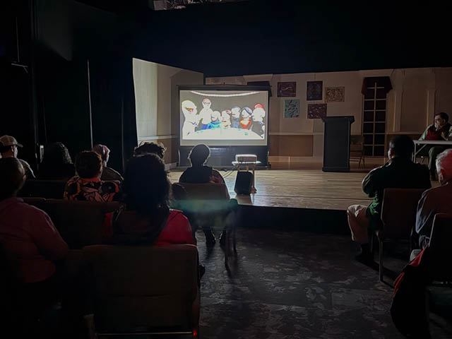 Photo: A packed house gets "animated" during the stop motion portion of Gentile's Mythology.