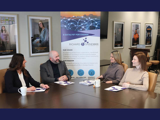 People in a conference room at Shineman. L to R: Bridget Dolbear, Kevin Dean, Chena Tucker, and Kelly Green