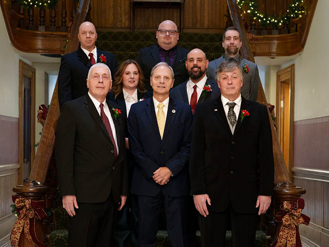 A photo showing members of the Common Council standing with Mayor Corradino on a set of stairs