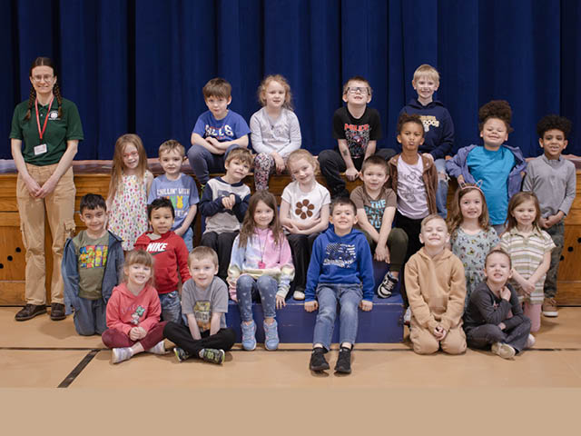 Photo of a group of students with a Cornell Cooperative Extension employee