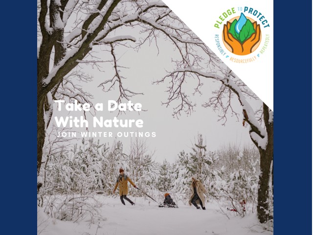 Snowy hike with adult towing child in sled.