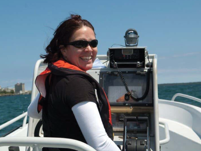 Stephanie Gandulla smiling on a boat