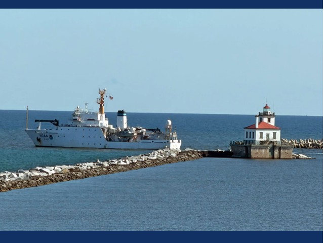 Large ship in water near the Oswego Lighthouse