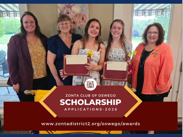 Five women with scholarship banner in front of them. Two younger women holding recipient certificates up for camera.                    