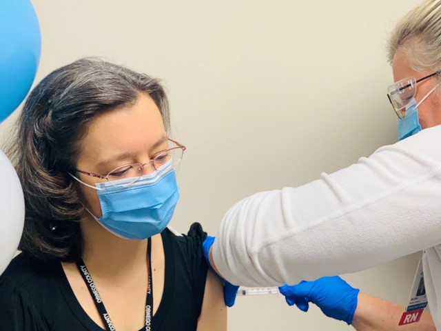 Health Care Workers and First Responders Receive COVID-19 Vaccines