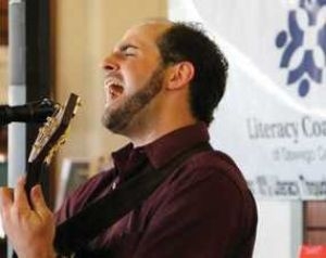 Literacy Coalition receives support from local singer-songwriter, Rotary club