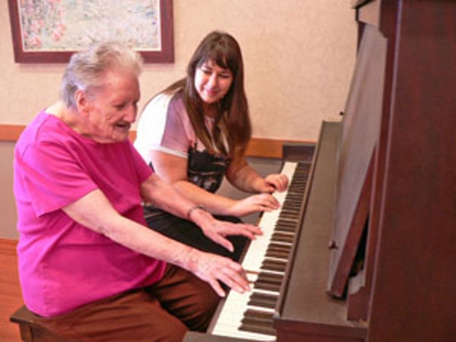 Residents at St. Francis Commons Learning a New Talent with the Help of SUNY Oswego Intern