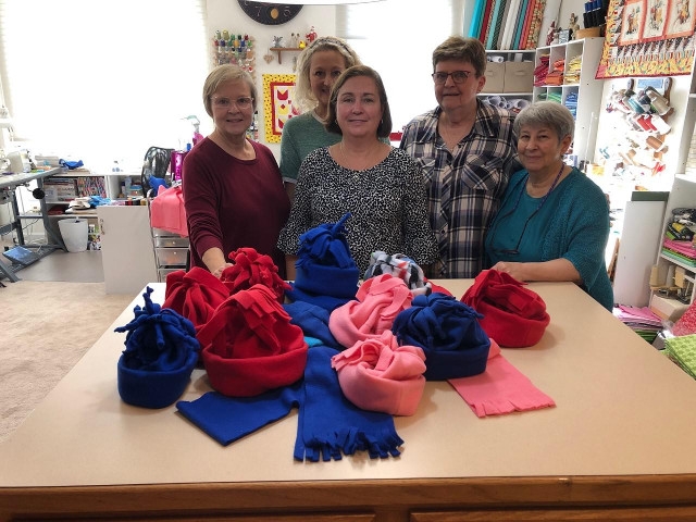 Oswego Children’s Board Create Hats, Scarves, Mittens for Children’s Fund