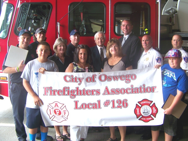 Oswego City Firefighters helps United Way Stuff-A-Bus