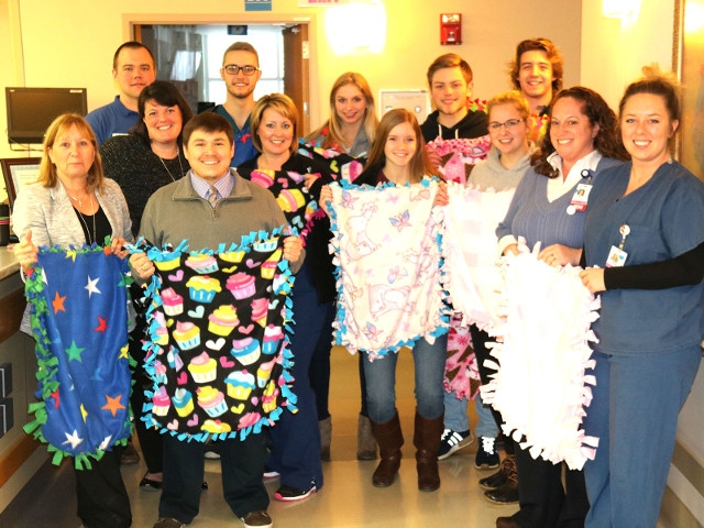 OHS Interact Club Delivers Infant Blankets to Oswego Health