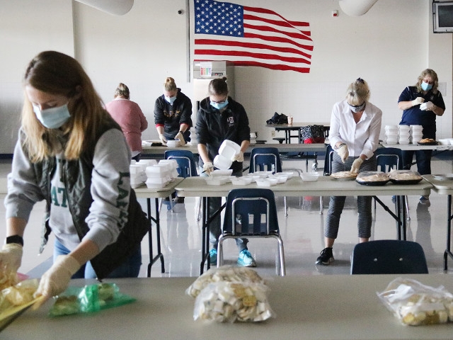 APW Staff Members Rally to Pack Thanksgiving Meals