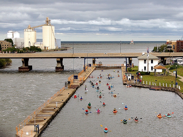 Nearly 300 Paddle Through Locks of Oswego River Canal